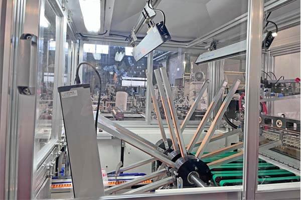Rotary windmill vacuum arms